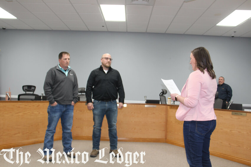 Scott Nichols and Jon Calhoun are sworn for the Mexico School Board at the April 15 meeting.