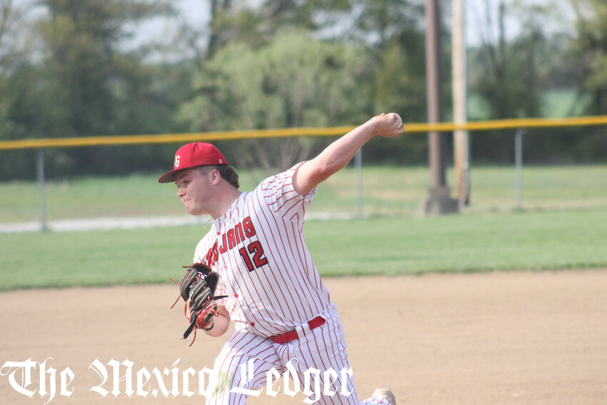 Community R-6 junior Kyler Swaim pitches in an earlier home game this season.