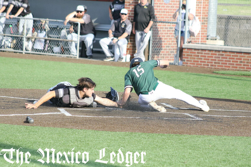 North Callaway sophomore Coltyn O'Neal slides into home to score against Fulton on Friday during a Southern Boone Classic tournament game in Mexico.