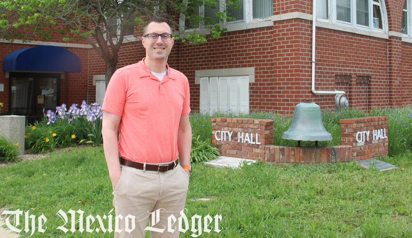 Nathan Mai-Lombardo stands outside city hall in Mexico. He recently joined the city and will have duties as the deputy city manager and director of community development.