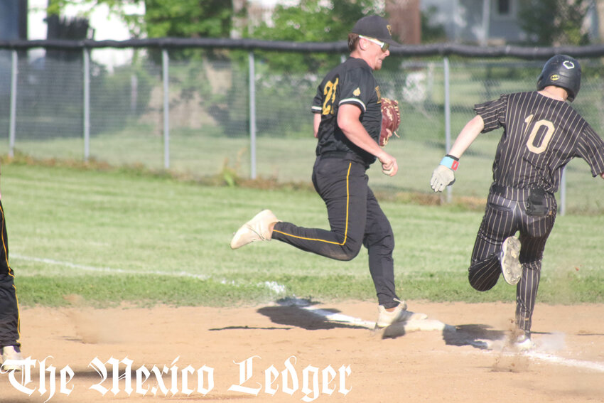 Van-Far senior Carson Huff steps on first base for an out against Cairo on Tuesday at home in Farber.