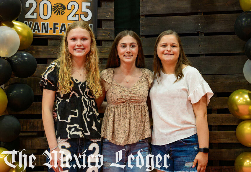 Valedictorians Erin Childs and Abigail Shelton with salutatorian Alaya Kampeter on their last day of school.