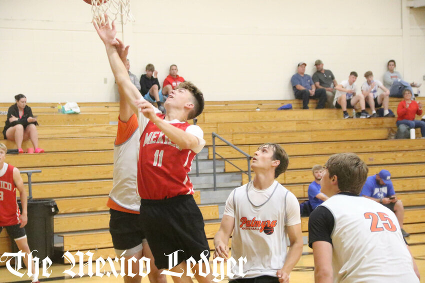 Mexico senior Kinser Groves makes a layup against Palmyra on June 4 at Monroe City Middle School during the Monroe City Shootout.