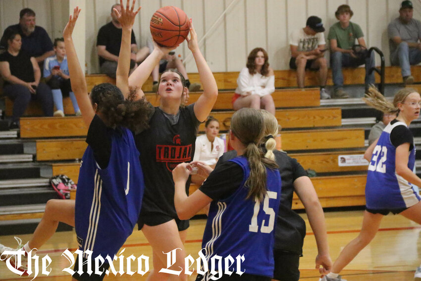 Community R-6 senior Jocelyn Curtis shoots over a Mark Twain defender on June 12 during a scrimmage at home in the high school in Laddonia.