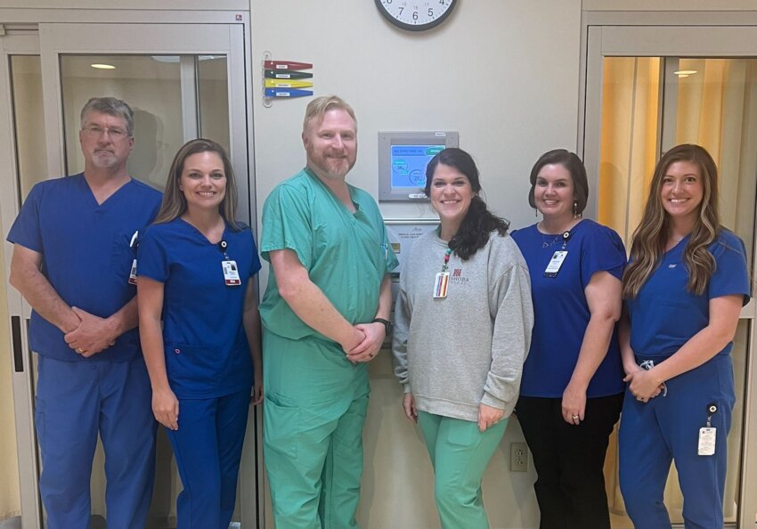 Pictured, from left, are Ron Chiasson, RN; Miranda Clark, RN; Dr. Guild, Medical Director; Racheal Page, Nurse Practitioner; Kristen Madison, Patient Navigator; and Christian Fitzhugh, Program Director.
