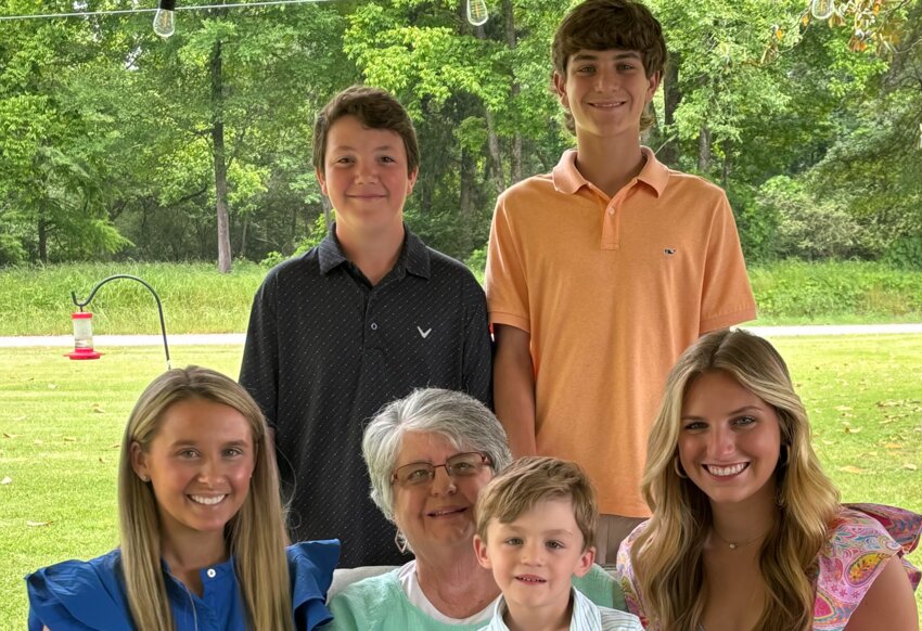 Rita Page seated with her grandchildren from left, Maggie Page Pebbles, Brody Page, and Addy Lea Page (Back) Ryder Furr and Easton Page.