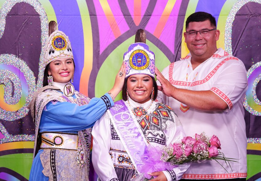 Outgoing 2023-2024 Choctaw Indian Princess Nalani LuzMaria Thompson, left, and Tribal Chief Cyrus Ben, right, crown Leilani Elyse Allen the 2024-2025 Choctaw Indian Princess. The event was held last week during the Choctaw Indian Fair.