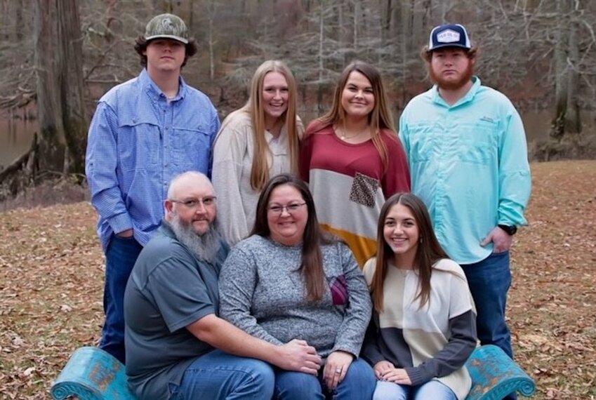 The Guess family: seated, from left, are Brian Guess, Mandy Guess, and Faith Schillaci (Back) Jordan Guess, Elizabeth Guess, Grace Guess, and Zachary Guess. Not pictured is Greta Guess.