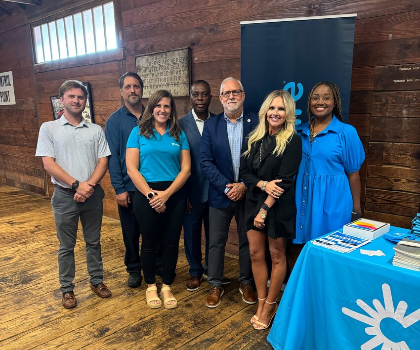 Pictured are, from left, Alex Camp, John Lopez, Lauren Langley, Joe Wilson, Jim Richmond, Eleanor Braswell, and Latoya Moore. Not pictured from C Spire was Kelley Lafleur.