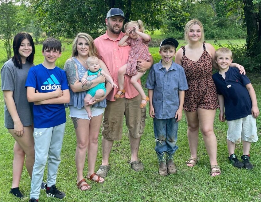 Dakotah Sullivan and her husband Tommy (center) with their kids, from left, Kadence, Aiden, Attison, Saylor, Axle, Baily, and Asher.