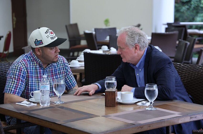 In this handout provided by Sen. Van Hollen's Office, U.S. Sen. Chris Van Hollen (D-MD) meets with Kilmar Armando Abrego Garcia (L) at an undisclosed location on April 17, 2025 in San Salvador, El Salvador. Abrego Garcia, a Maryland resident, was illegally deported by the Trump administration and has been held in prison in El Salvador since March 15.