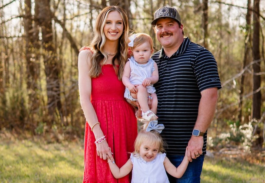 Cheyenne Henderson with her husband, Kyle, and their daughters, Harper and Emery.
