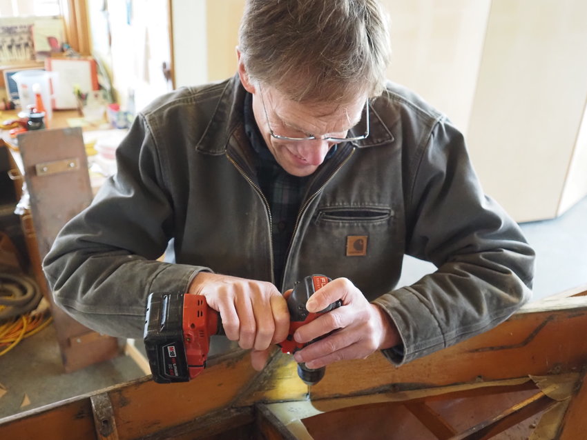 Woodworker Paul Carter precisely picks apart a stripped screw.