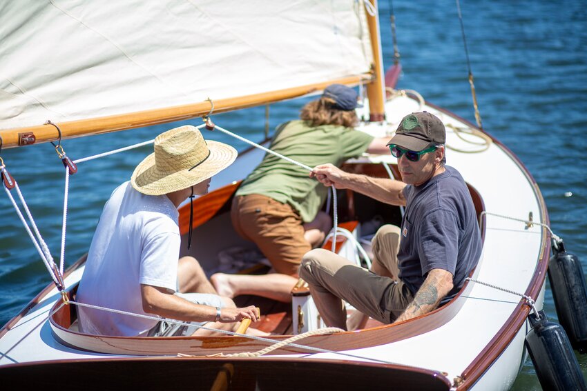 Joel Schultz (left) and Jack Thorp sail out with their instructor Bruce Blatchley.