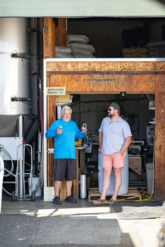 Guy Sands and Buster Ferris enjoy the festivities at Port Townsend Brewing during the BrewFest event Saturday.