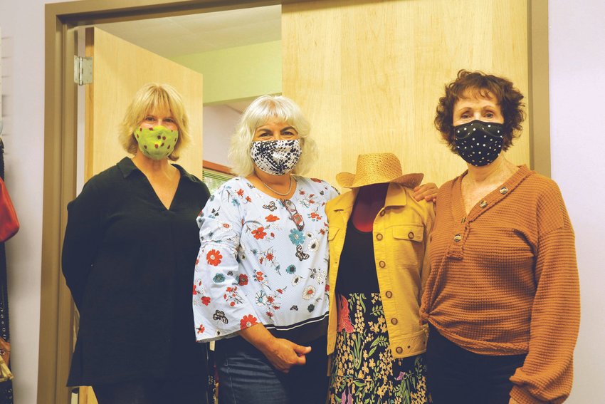 New Image Board Members, Leslie Freeman, Martha Olbrych and Jeanne Clark, from left, pose with a mannequin displaying a typical outfit curated for the nonprofit&rsquo;s clients.