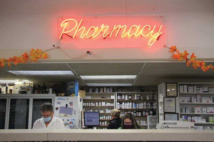 Pharmacist Don Hoglund works behind the counter at his pharmacy, Don&rsquo;s Pharmacy. Hoglund recently announced that he plans to sell the business, but will remain on staff.