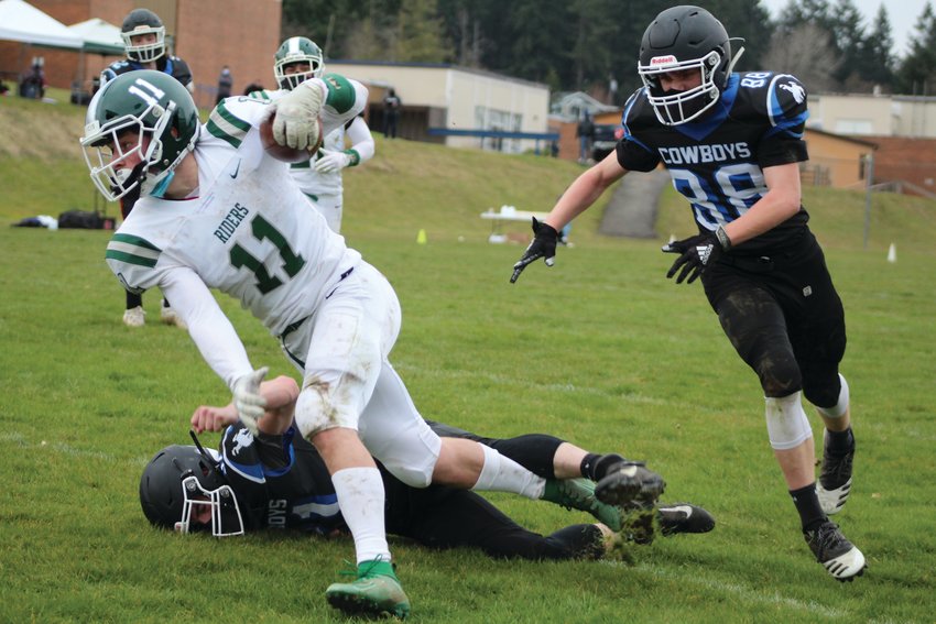 East Jefferson linebacker Joe Savill is in hot pursuit of a Roughriders runner during the varsity football matchup against Port Angeles last week.