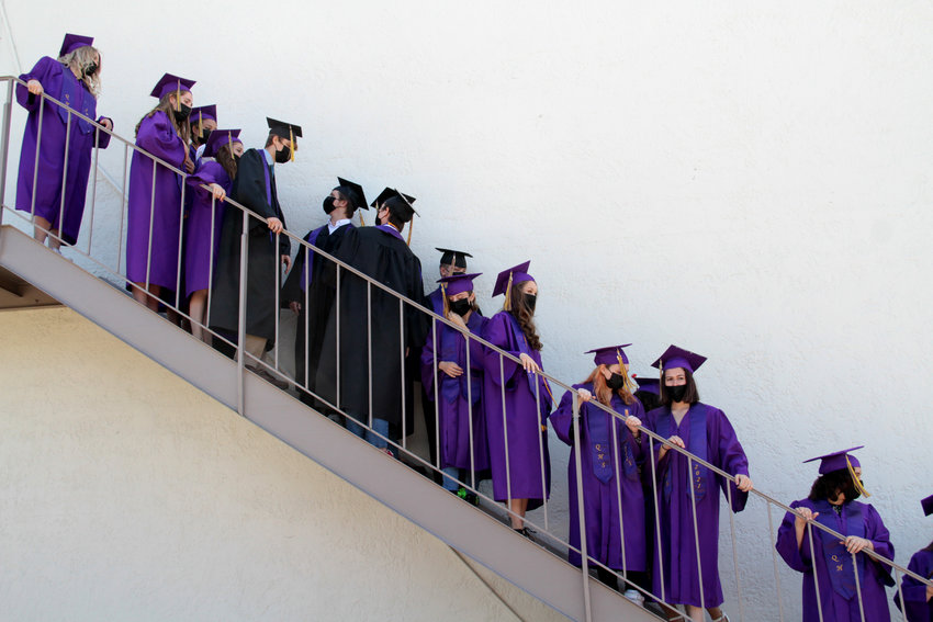 Quilcene graduates gather on a stairway outside the school for one last group photo before commencement.