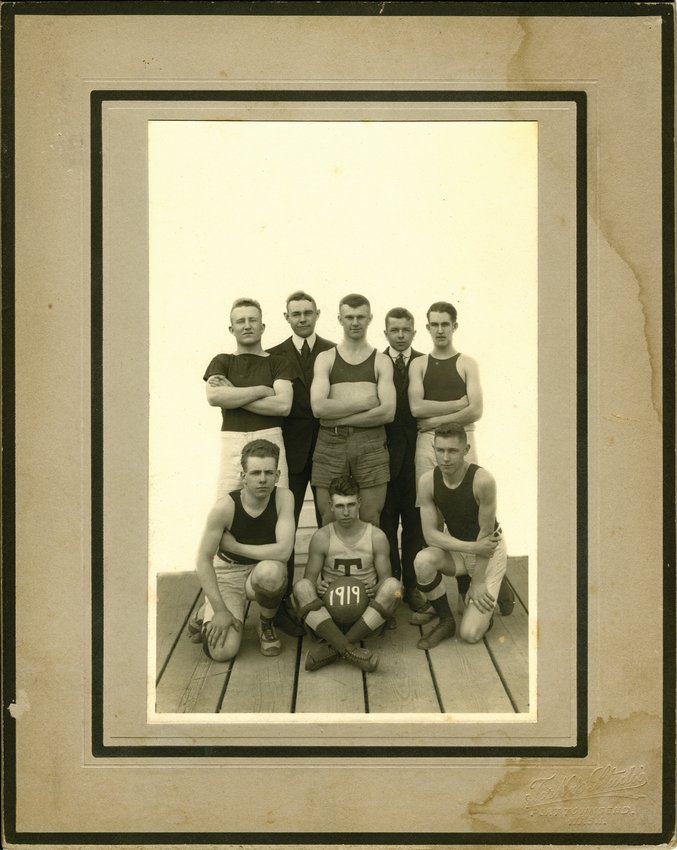 Some of the Port Townsend basketball team members who squeaked by Chimacum 10-9. In front: Clarence Olberg, Lawrence Stromberg, Harvey Klassell. In the rear: Graham Ralston, H.R. Taylor (coach), Leo Ziel (captain), Henry McManus (manager), Frank Stromberg.