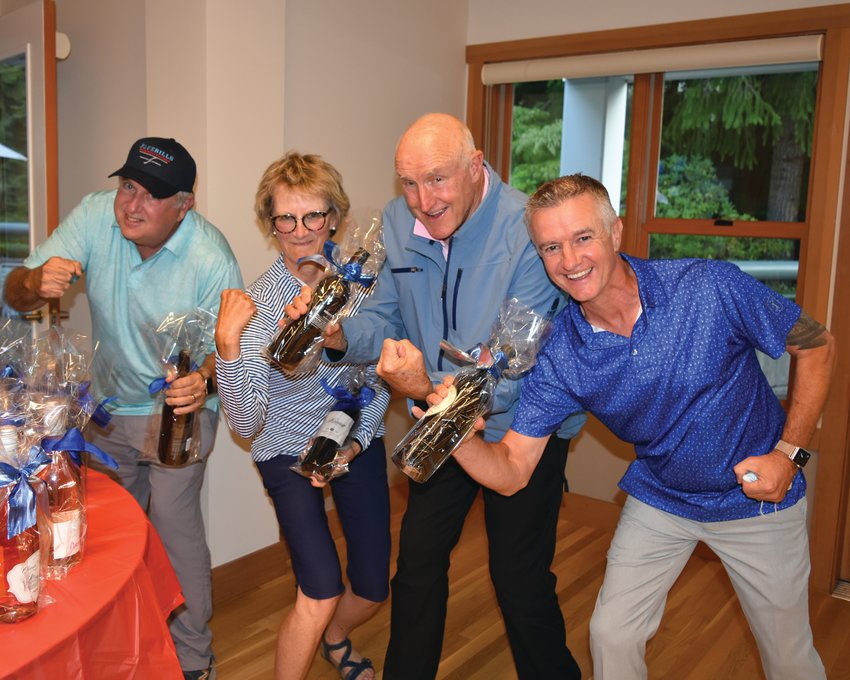 Dave Jackson, Lucinda Thompson, Shelley Washburn, and Gary Baird won the mixed division during the Dove House Golf Tournament.