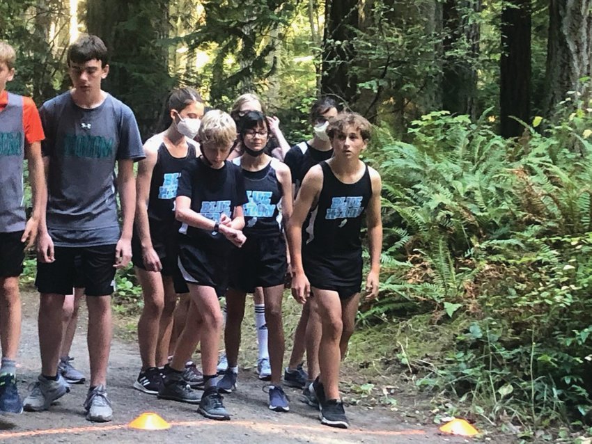 Ready to race, in the front line, are Noah Isenberg, Leah Ferland, and Grady White, while Sienna Emerson, Lily Justis, and Michael Gregg are ready to kick off in the second line. Port Townsend runners not pictured but who participated in the race are Bella Ferland and Atom Barrett.