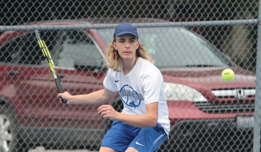 Reid Martin keeps his eyes on the ball during No. 1 singles at the recent matchup against Annie Wright School&rsquo;s Owen Hayes in boys varsity tennis.