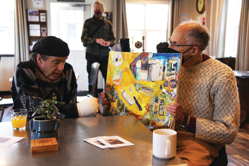 Craig Rogers shares the inspiration behind &ldquo;The Artist&rsquo;s Studio&rdquo; while close friend Robert Komishane holds the piece.