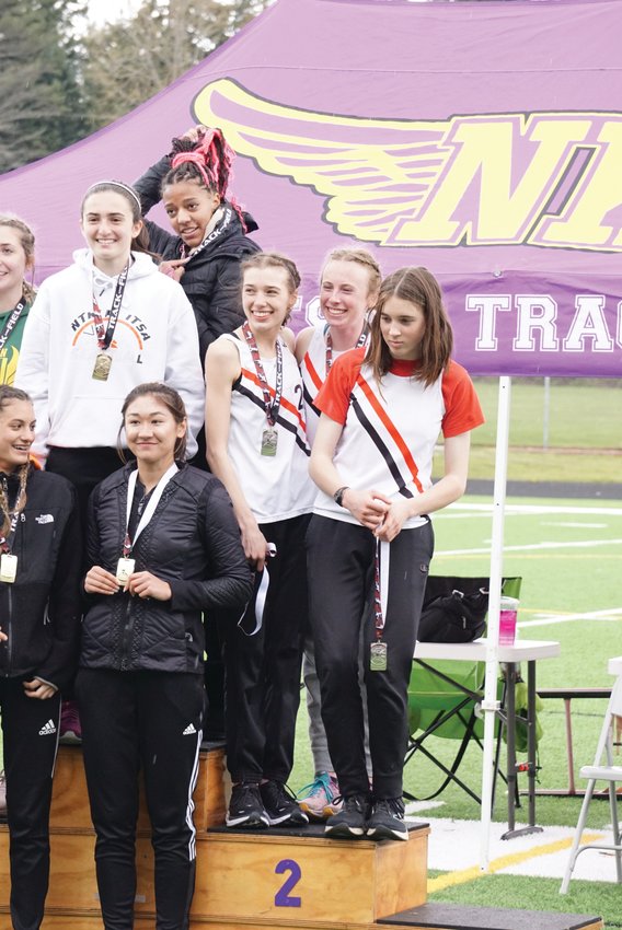 Members of the Rivals girls medley relay team (minus Lia Poore) pose during the awards ceremony at the Li&rsquo;l Norway Invitational track event in Kitsap County.