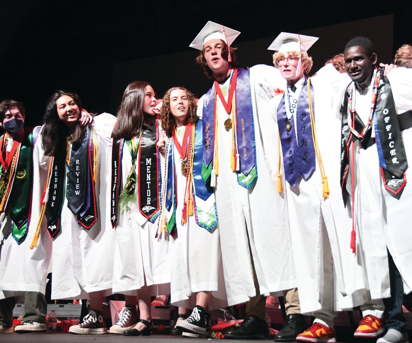 Port Townsend High School graduates sing and sway to their alma mater at the end of Friday&rsquo;s ceremony.