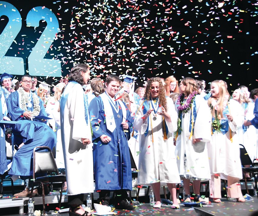Chimcum seniors celebrate with confetti and cheer following their graduation ceremony.