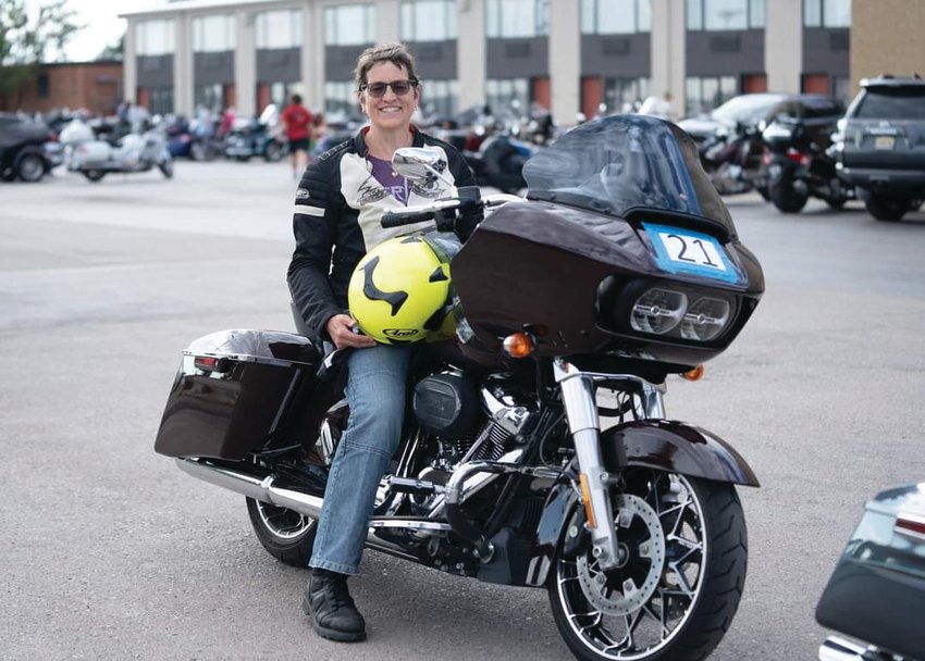 Marcia Kelbon sits on her Harley-Davidson at a ride in South Dakota a week before the crash on Highway 104.