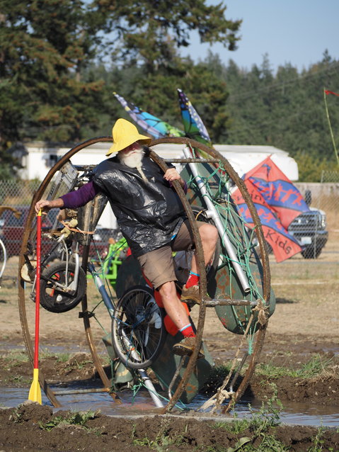 Peter Wagner climbs his World&rsquo;s Largest Bitcoin to power it through the depths of the &ldquo;Dismal Bog&rdquo; at the fairgrounds.