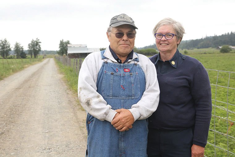 Roger and Sandy Short stand on Short&rsquo;s Family Farm in 2016 shortly after the conservation easement to Jefferson Land Trust permanently protected the farmland as agriculture.