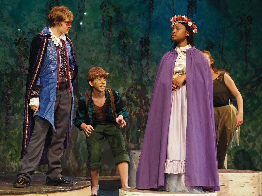 Senior Sophia Huber at left in the role of Oberon the Fairy King, locks eyes with the Fairy Queen Titania, right, played sophomore Rain Varnie, while sophomore Peter Sanok as Puck plays between them.
