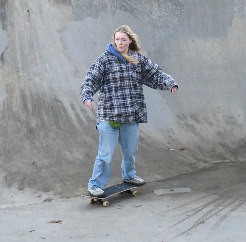 Port Townsend High School senior Samantha Stromberg carves through one of the bowls in the Port Townsend Skatepark.
