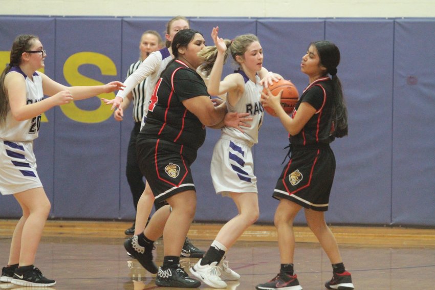 Brianne Evans tries to push away a defending Savannah McBride during the first half of last week&rsquo;s game. Evans was called for an offensive foul.