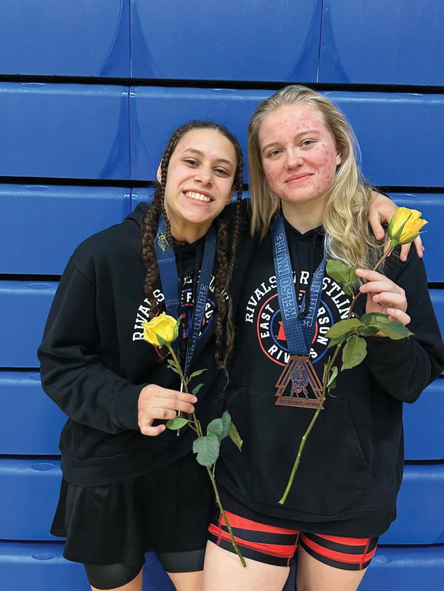 Mi Amada Lanphear Ramirez and Melody Douglas pose after wrestling in the WIAA Kelso Girls Invitational, the largest girls&rsquo; tournament in the nation.