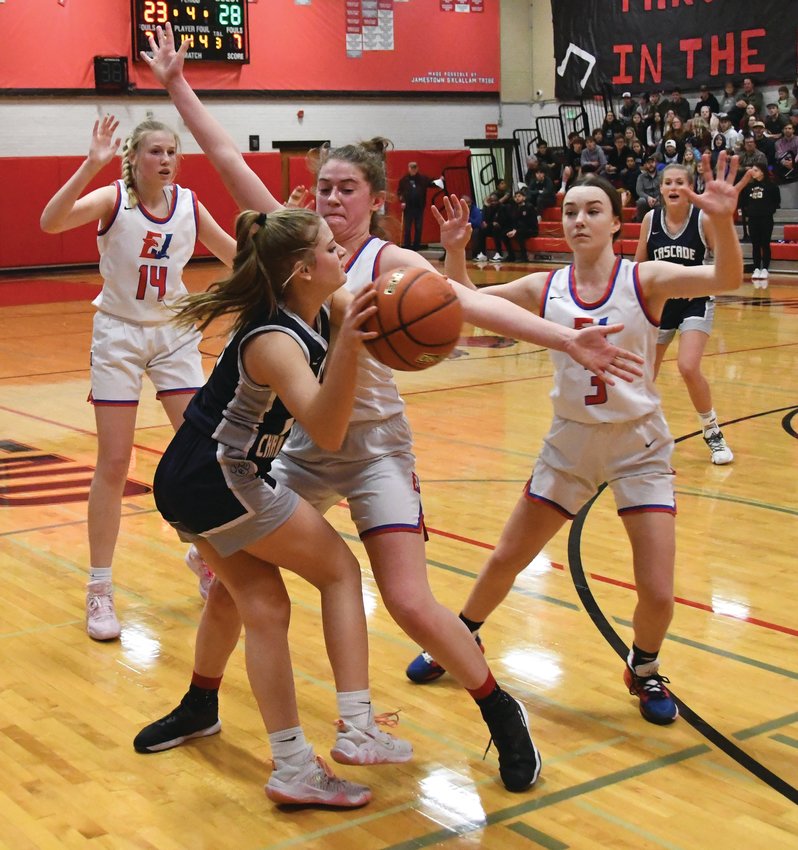 EJ&rsquo;s Addy Asbell (center), Abbie Liske (left), and Kay Botkin (right) apply defensive pressure to a Cougar player during the fourth period.