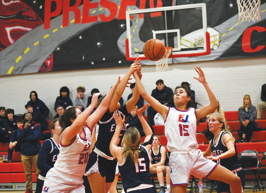 EJ&rsquo;s Alyssa Vandenberg and Penina Vailolo reach for a rebound while surrounded by Eagles players.