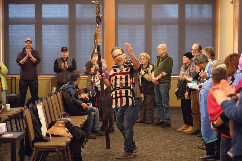 Sul ka dub, or Freddie Lane, a member of the Lummi Nation, raises up the pole which will be carried to Oak Flat.