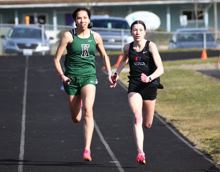 EJ junior Aliyah Yearian runs neck-and-neck with Klahowya junior Amelia Mayes during the girl&rsquo;s 1600-meter race, which Yearian won with a time of 5:21.28.