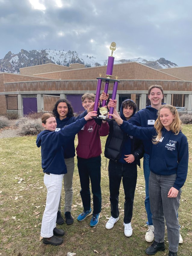Port Townsend High School students Sophie Kunka, Lhotse Rowell, Indigo Gould, Ashton Meyer-Bibbins, Stuart Dow, and Maeve Kenney pose with their first place trophy in Wenatchee after winning the Knowledge Bowl.