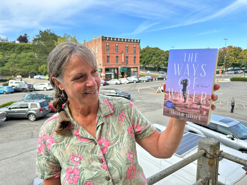 Teresa Janssen with a reader&rsquo;s copy of her soon-to-be-released book.