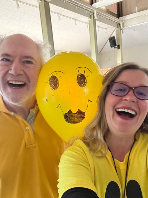 Olga Alexander, right, with Bill Cohill, left, and an unidentified (but happy) balloon head.