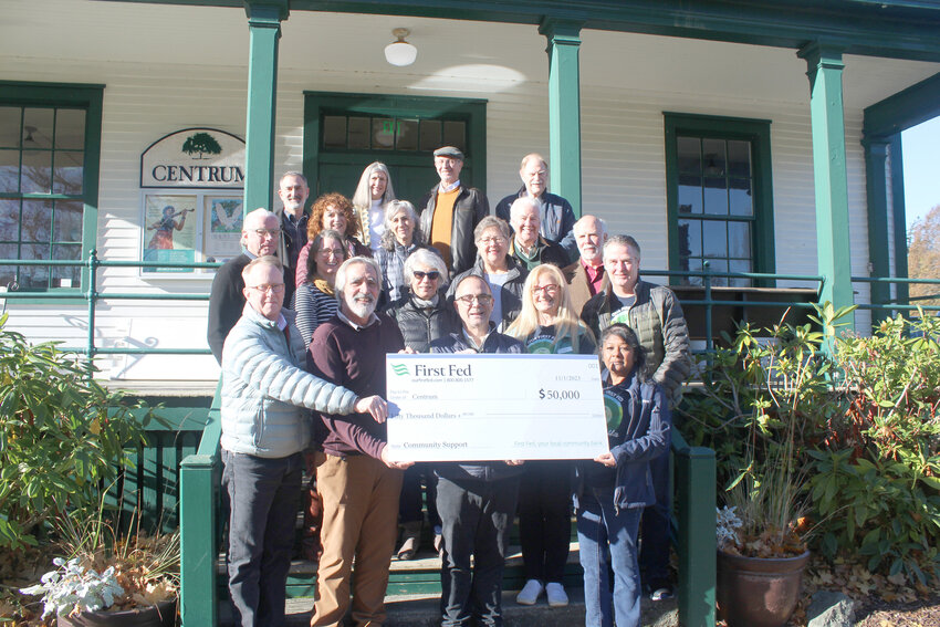 First Fed presents a generous charitable donation to the Board and Staff at Centrum in honor of the arts non-profit's 50th anniversary in Port Townsend. Pictured (front row L-R) Centrum Executive Director Robert Birman, Centrum Board Chair Scott Wilson, First Fed Board Member Norm Tonina, First Fed Port Townsend Branch Manager Luxmi Love; 2nd Row: Walter Parsons, Katy Goodman, Catharine Robinson, Sara Spalding, John Murock; 3rd Row: Kris Easterday, Renee Klein, Leah Mitchell, Robert Alexander, Sam Shoen; 4th Row David Rinn, Jeanie Cardon, Andy Fallat, Malcolm Harris.