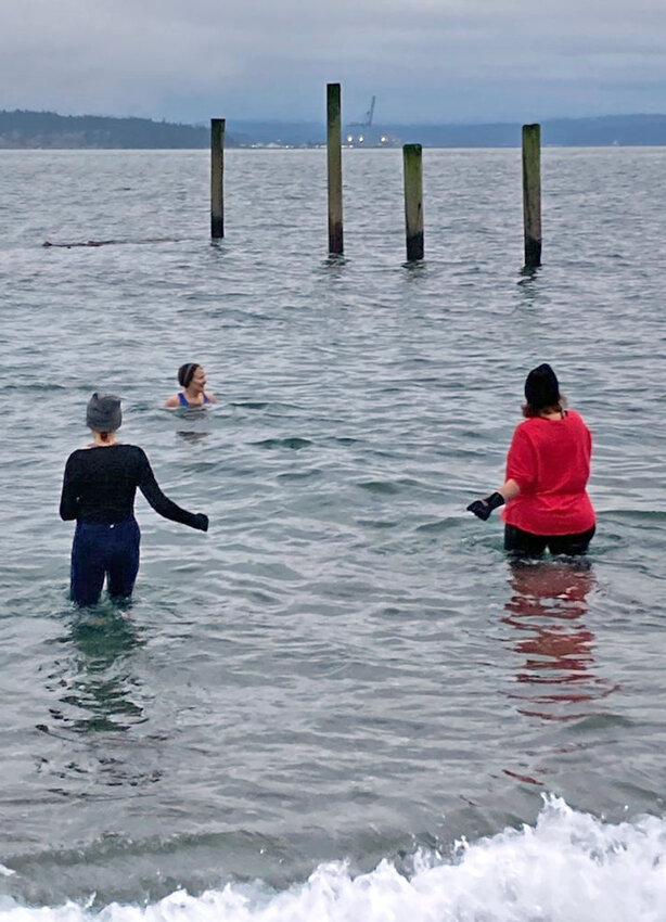 Janice Camfield and Dawn Reis join Heidi Camfield for an early-morning plunge in the winter waters off of the Point Wilson.&nbsp;&nbsp;