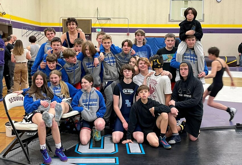 East Jefferson Rivals Middle School wrestlers pose at the beginning of a Wednesday afternoon meet in Sequim. Six of last year&rsquo;s eighth-graders are currently on the high school&rsquo;s wrestling team, including Gracee Liske, Seth Nielsen, Jackson Dupuy, Caleb Johnson, Damien Ilarraza, and Silas Klontz.