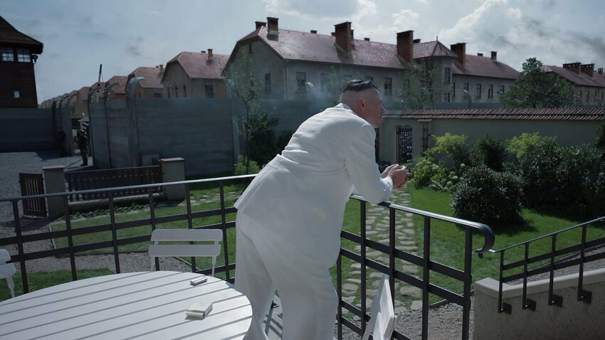German SS officer Rudolf H&ouml;ss (played by Christian Friedel) surveys his home's backyard, and the Auschwitz concentration camp it overlooks, in Jonathan Glazer's &quot;The Zone of Interest.&quot; Courtesy photo