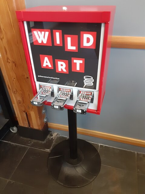 The Wild Art Portal dispenses miniature artworks at Reveille Cafe. Leader photo by Kirk Boxleitner